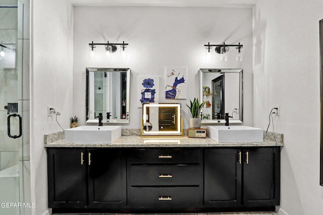 bathroom with vanity and an enclosed shower