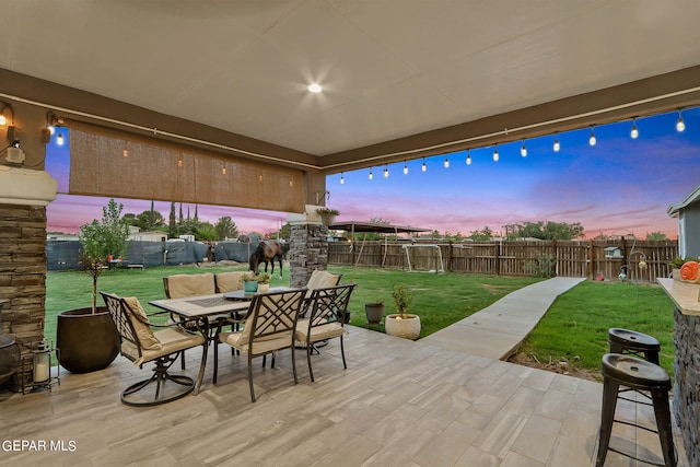 patio terrace at dusk with a yard