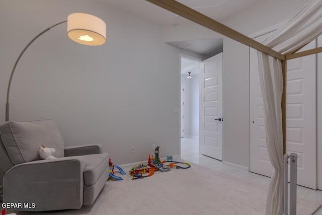 living area with light colored carpet