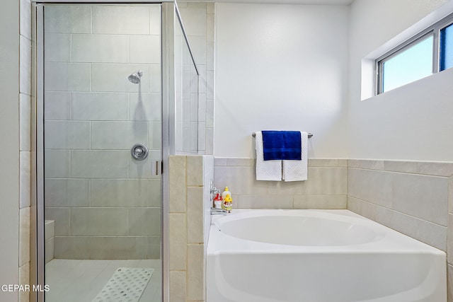 bathroom with independent shower and bath