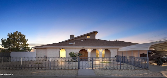 view of front of property with a carport