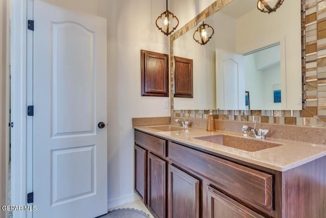 bathroom featuring decorative backsplash and vanity