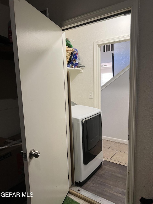 washroom featuring washer / dryer and wood-type flooring