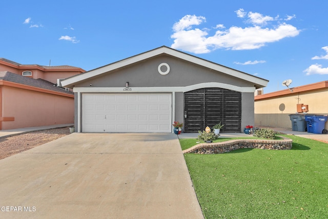 view of front facade featuring a garage and a front yard