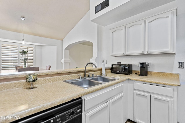 kitchen featuring white cabinets, dishwashing machine, lofted ceiling, and sink