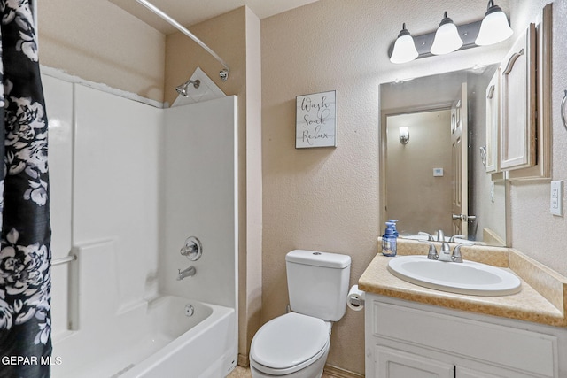 full bathroom with vanity, toilet, and washtub / shower combination