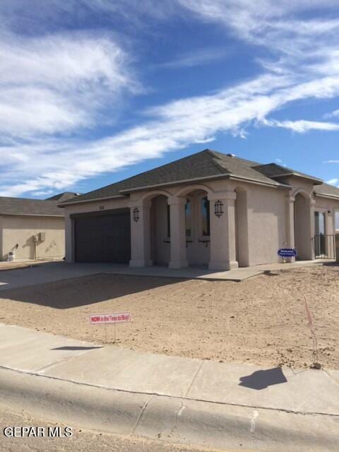 view of front of property with a garage