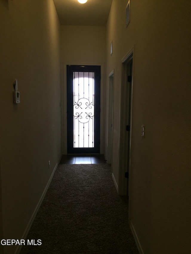 entryway featuring light carpet