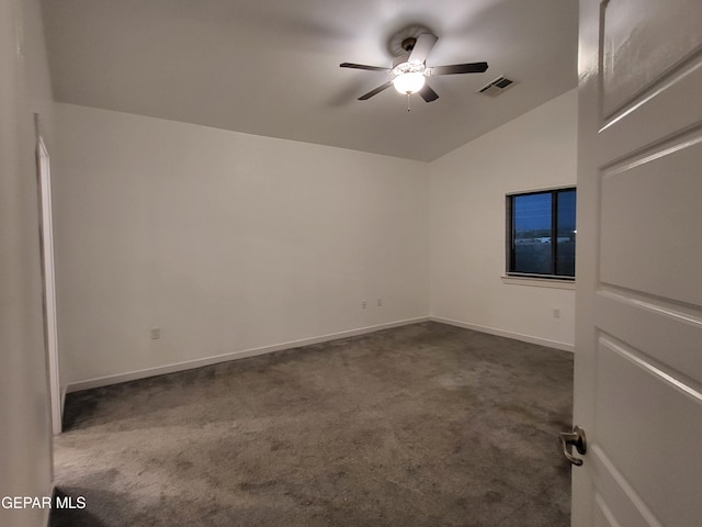 carpeted spare room with ceiling fan and lofted ceiling