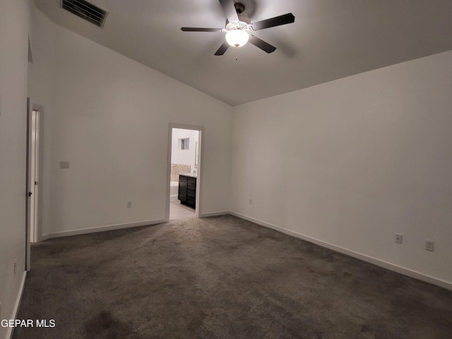 carpeted spare room featuring ceiling fan and high vaulted ceiling