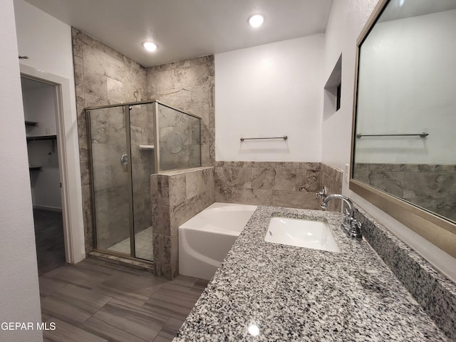 bathroom featuring sink and plus walk in shower