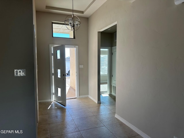 foyer featuring a chandelier