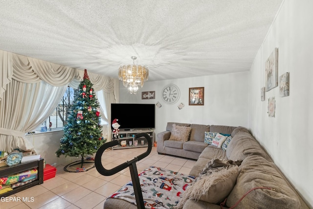 living room featuring light tile patterned floors, a chandelier, and a textured ceiling