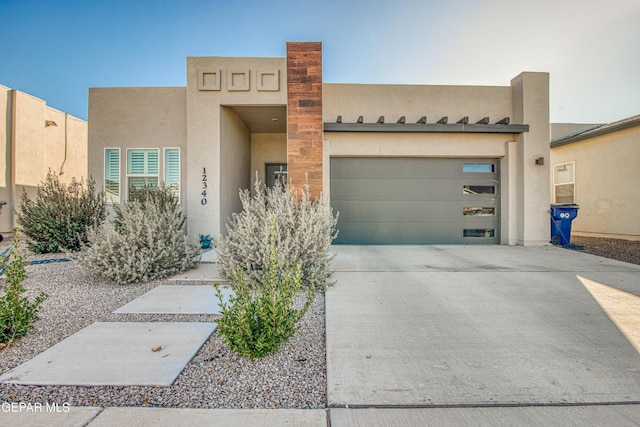 adobe home featuring a garage