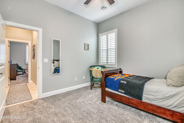 carpeted bedroom with ceiling fan