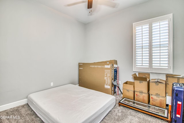bedroom with ceiling fan and carpet