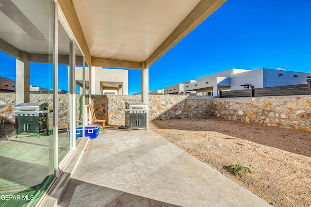 view of patio featuring a grill
