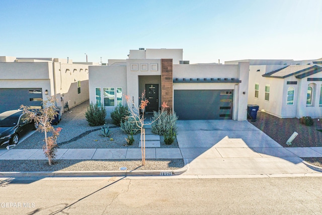 adobe home featuring a garage