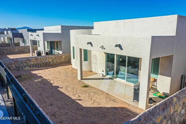 back of house featuring a patio area