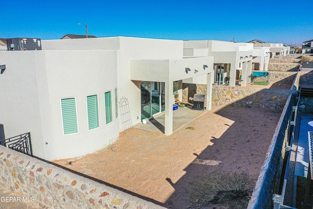back of house featuring a patio area