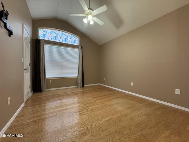 unfurnished room featuring ceiling fan, lofted ceiling, and light hardwood / wood-style flooring