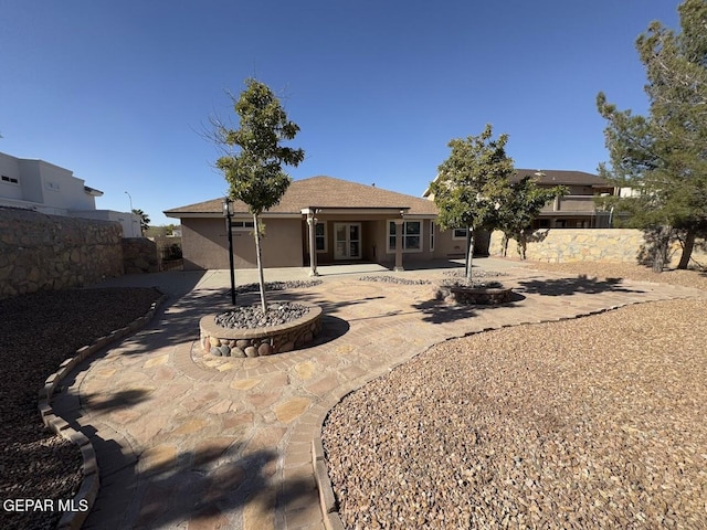 rear view of property featuring a patio area