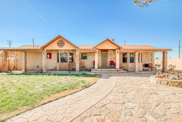 ranch-style home with a front yard