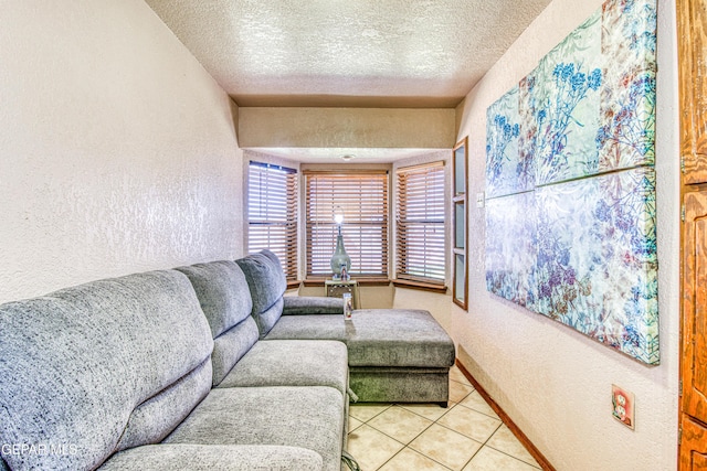 living room featuring tile patterned flooring and a textured ceiling