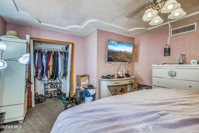 bedroom with carpet floors, a textured ceiling, and a closet