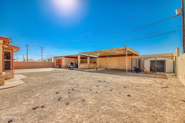 rear view of house featuring an outdoor structure