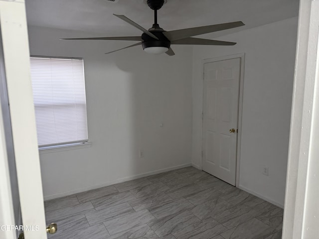 spare room with ceiling fan