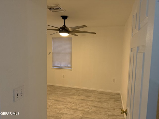 spare room with ceiling fan