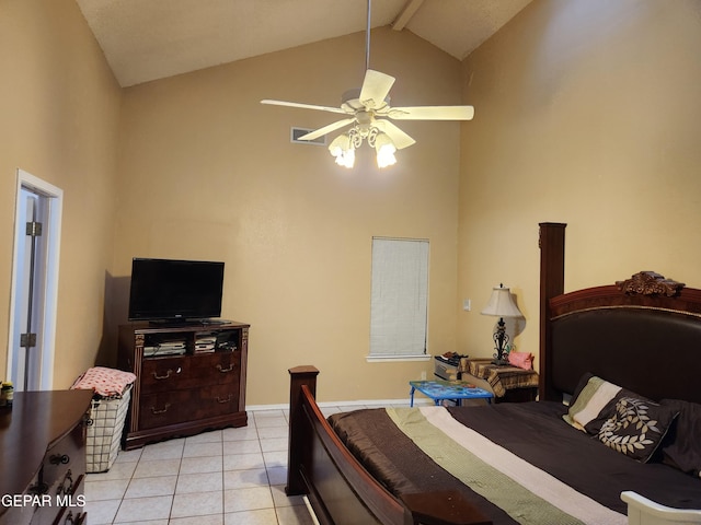 tiled bedroom with ceiling fan and high vaulted ceiling