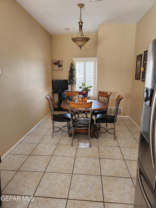 dining area with light tile patterned flooring