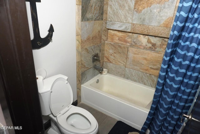 bathroom with shower / bath combo and toilet