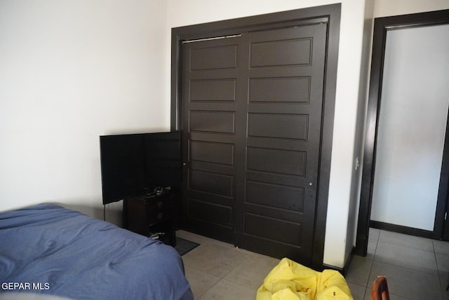 bedroom with light tile patterned floors