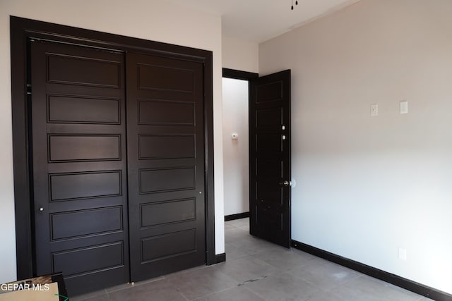 unfurnished bedroom with light tile patterned floors