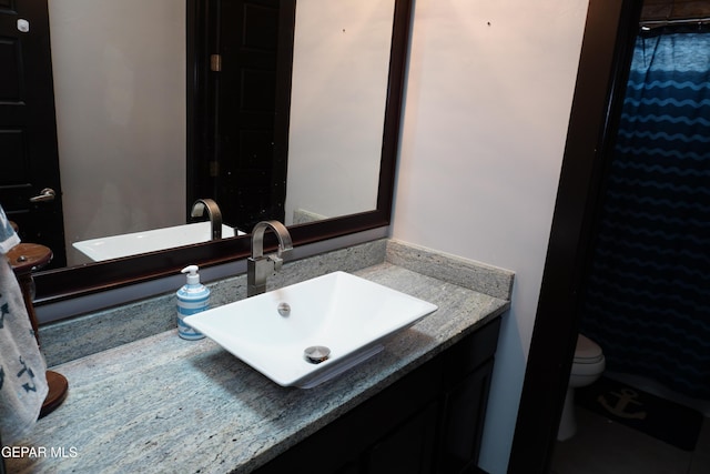 bathroom with vanity and toilet