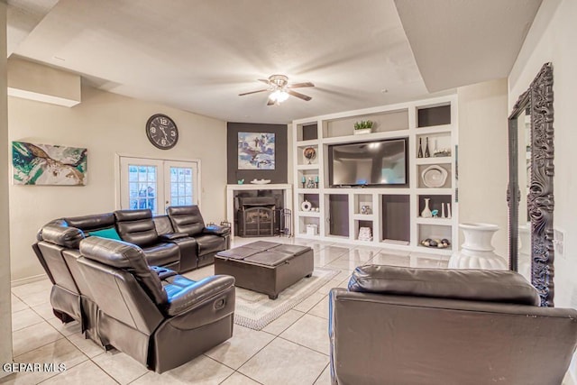 living room with ceiling fan, french doors, and light tile patterned floors