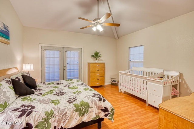 bedroom with ceiling fan, french doors, light hardwood / wood-style floors, vaulted ceiling, and access to outside