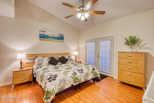 bedroom featuring ceiling fan, french doors, wood-type flooring, and vaulted ceiling