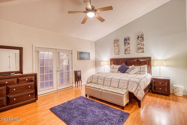 bedroom featuring french doors, access to outside, ceiling fan, wood-type flooring, and high vaulted ceiling