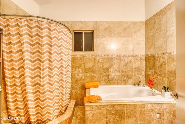 bathroom with a relaxing tiled tub