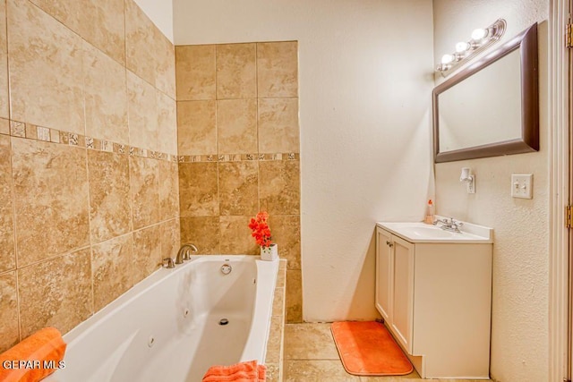 bathroom with tile patterned floors, vanity, and a tub to relax in