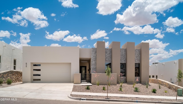 southwest-style home featuring a garage