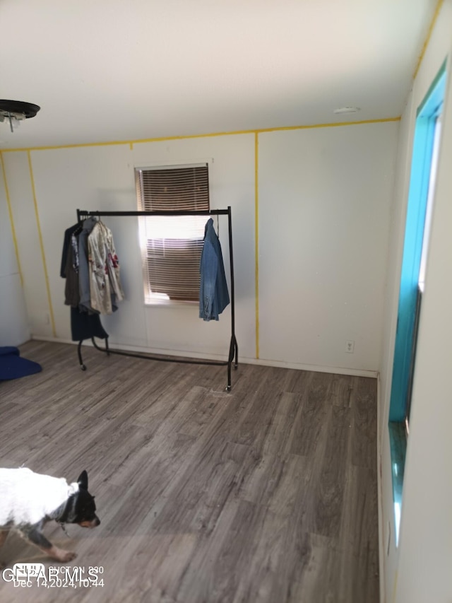 unfurnished bedroom with hardwood / wood-style floors