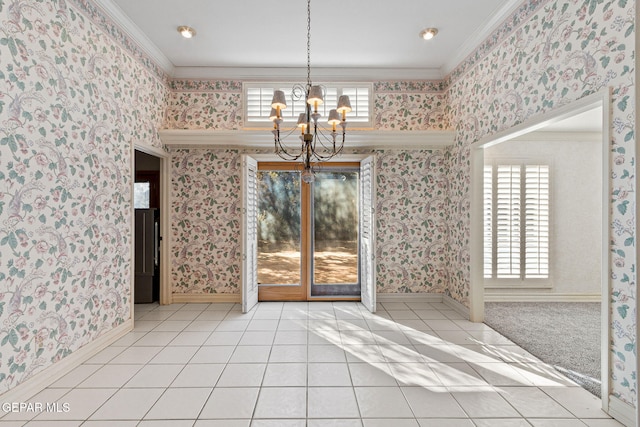 unfurnished dining area featuring tile patterned flooring, a notable chandelier, crown molding, and wallpapered walls