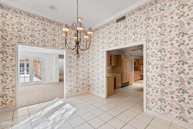 spare room with wallpapered walls, crown molding, light tile patterned floors, and visible vents