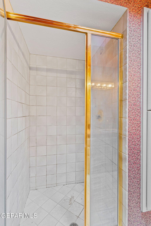 full bath featuring a shower stall