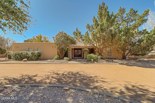 view of front of house featuring stucco siding